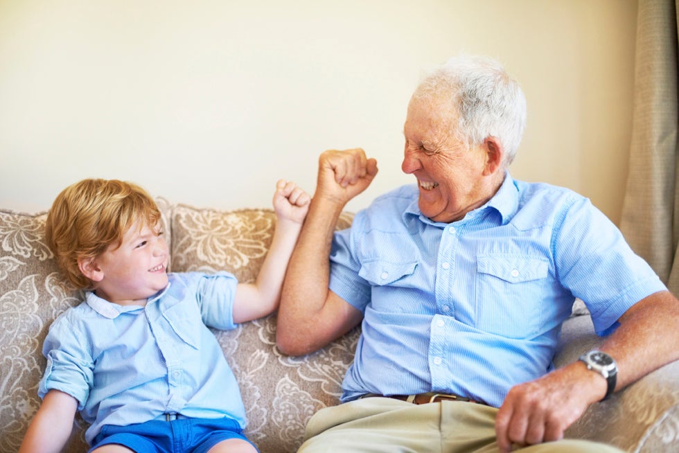 old man playing with a child
